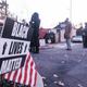 A Black Lives Matter sign outside next to an American flag is seen at a polling station in the King Arts Complex on November 3, 2020 in Columbus, Ohio.